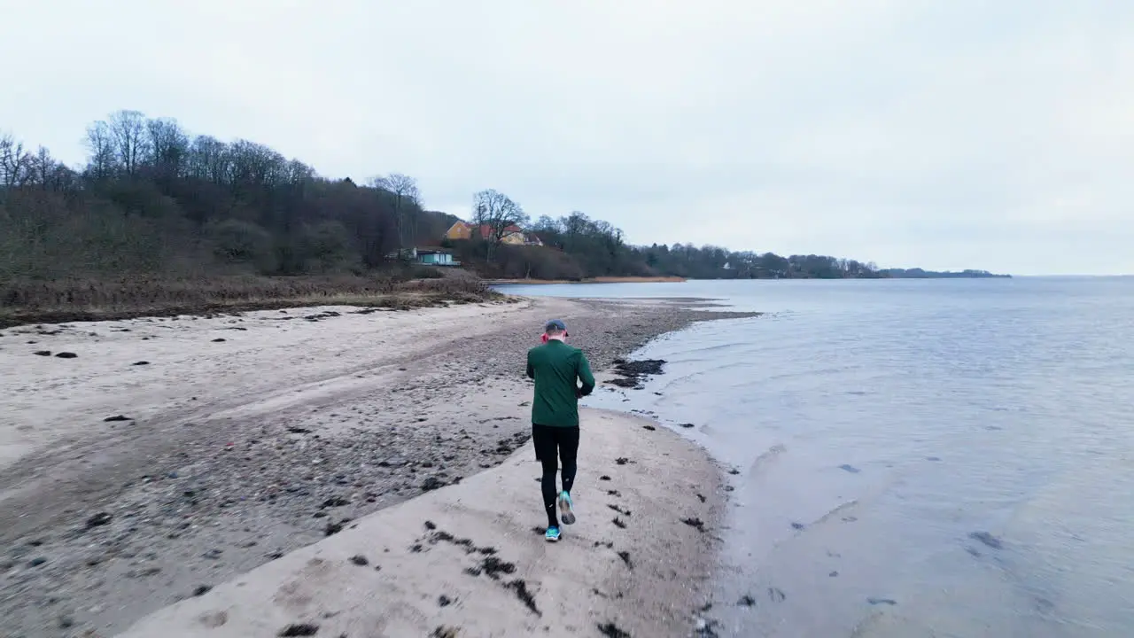 Solitary jog along the winter beach