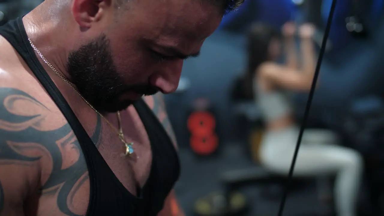 male bodybuilder engaging in weightlifting exercises within a dynamic gym environment