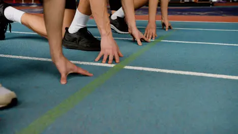 Three athletes in a running track