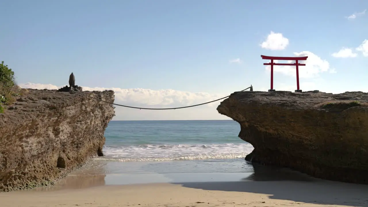 Beautiful scenery at famous Shirahama beach in Japan with rocks and traditional Torii gate