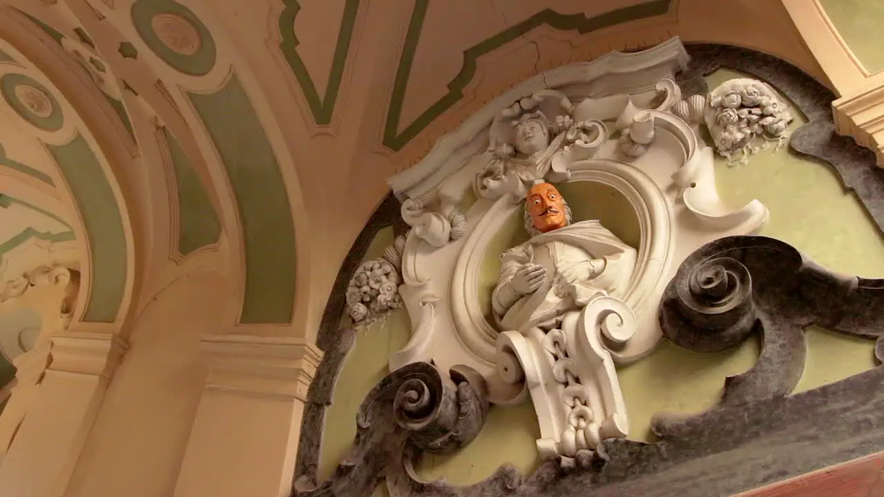 Low Angle View Of Orange Faced Statue Of Salvador Dali In Naples Italy