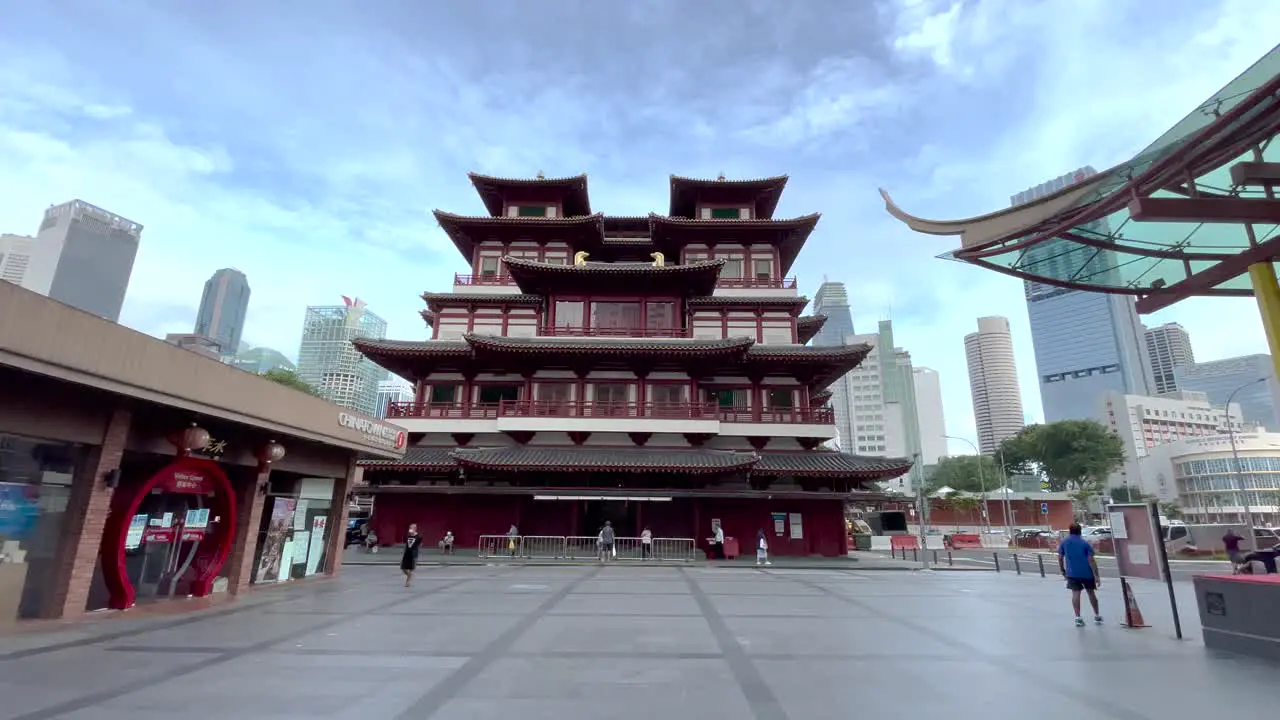 People walking at public square by Buddha Tooth Relic Temple Singapore