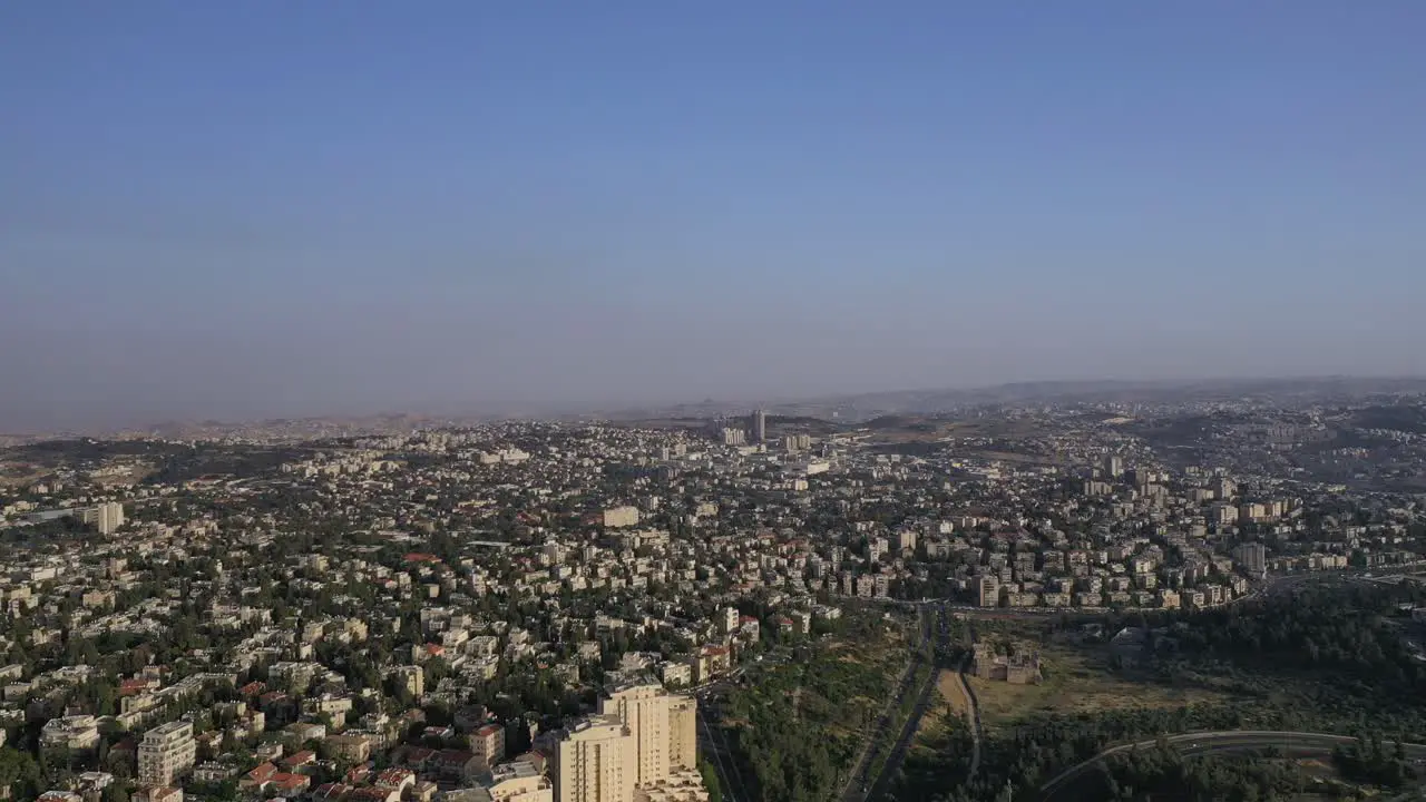 Aerial far long shot of Jerusalem city urban area from the sky clear day