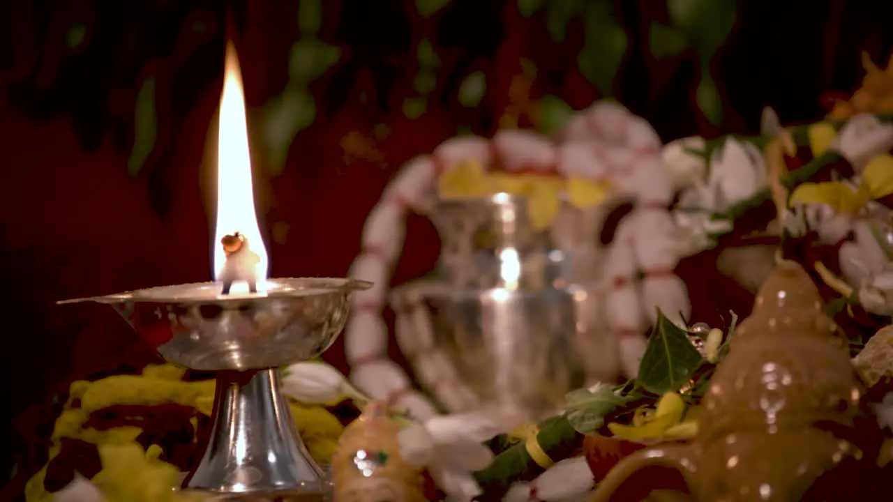 Silver Diyas in front of the gods which are used lighting up the house during pooja times in Hindu religion