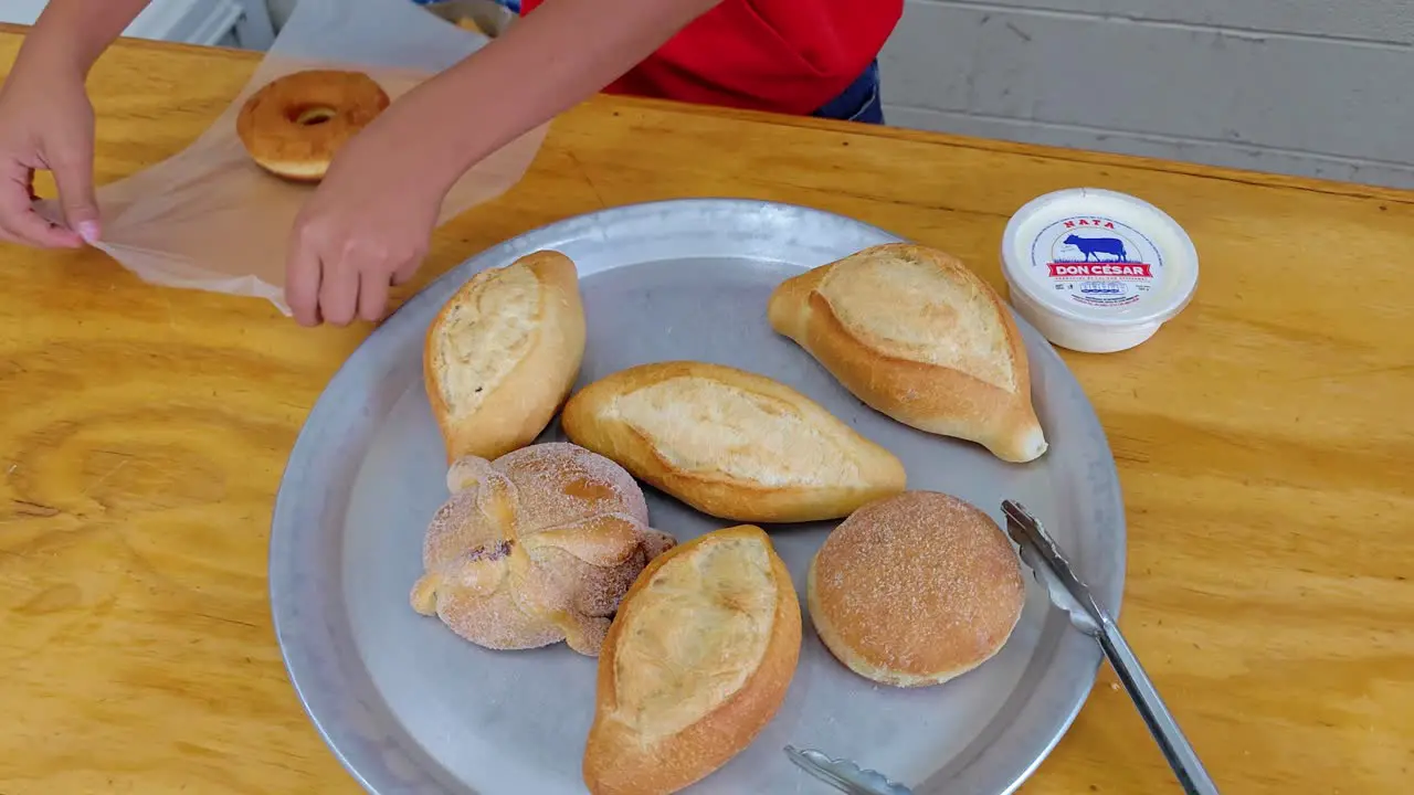 Wrapping a chocolate donut at a real Mexican Bakery in Querétaro México