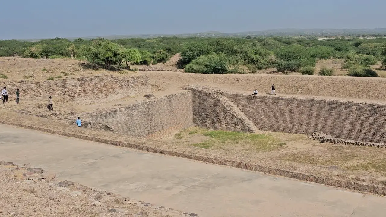 Wide shot Dholavira Archeology Heritage Site people watching the legacy of a 5000 year old civilization