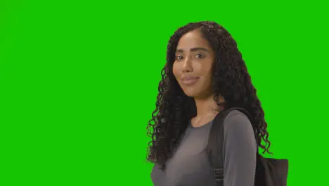 Portrait Of Female College Or University Student Against Green Screen Smiling At Camera 1