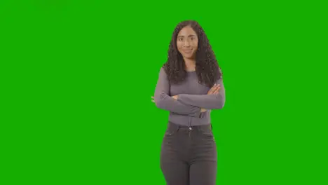 Three Quarter Length Studio Portrait Of Woman Against Green Screen Smiling At Camera 2