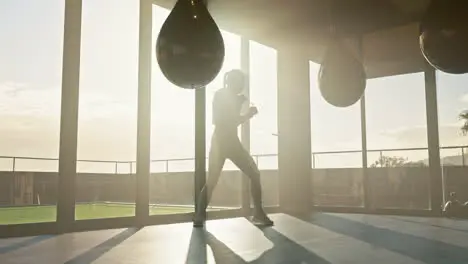 Fitness boxing and woman training with a punching