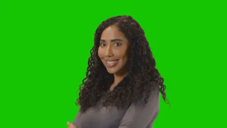 Portrait Of Woman Against Green Screen Smiling At Camera 3