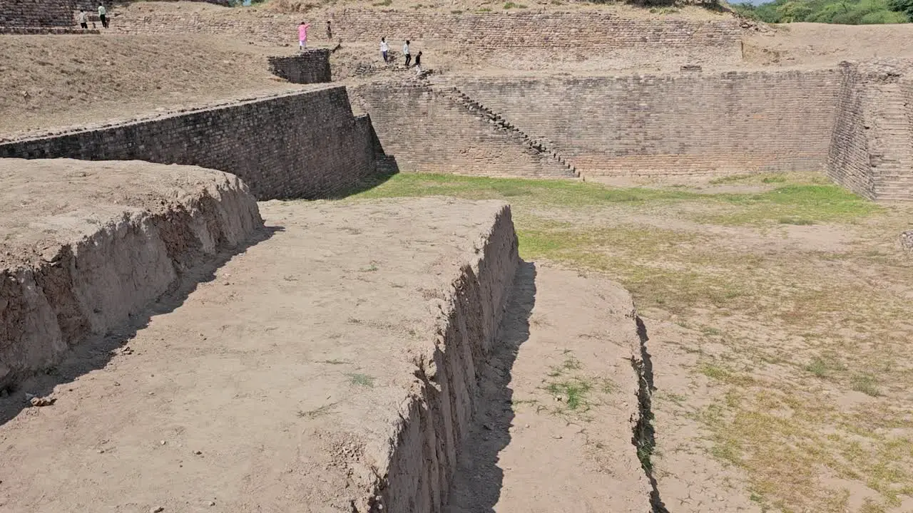 People look at the Dholavira Archeology Heritage Site a site built by the extinct Modern Way