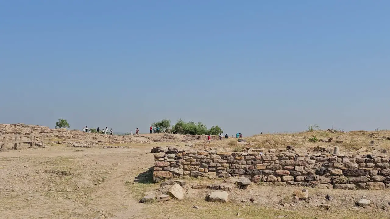 Dholavira Archeology Heritage Site people with their families looking at the 5 000-year-old archeology site