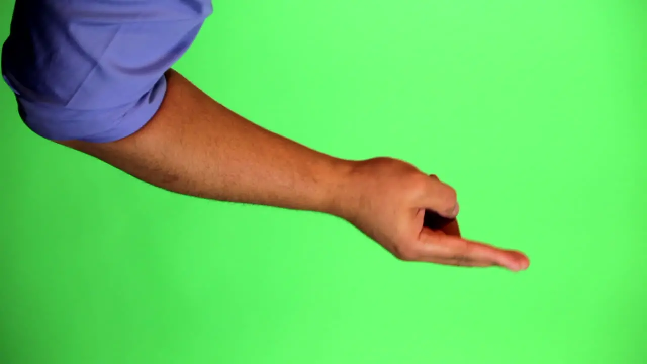 An arm in front of a green screen to be keyed and used at will