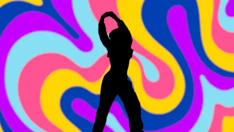 Studio Silhouette Of Woman Dancing Against Multi Coloured Pattern Background