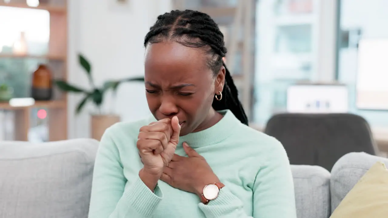 Cough sick and black woman on a sofa with sore