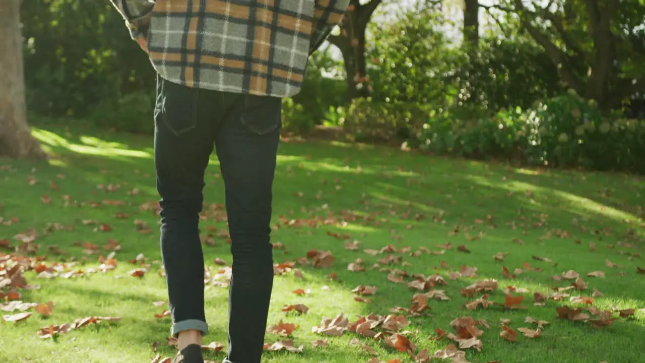 Video of happy caucasian warmly men dressed spending in the garden