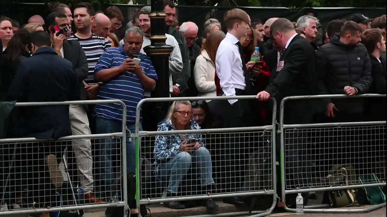 A crowd of people waiting for the Queen to go past towards Windsor