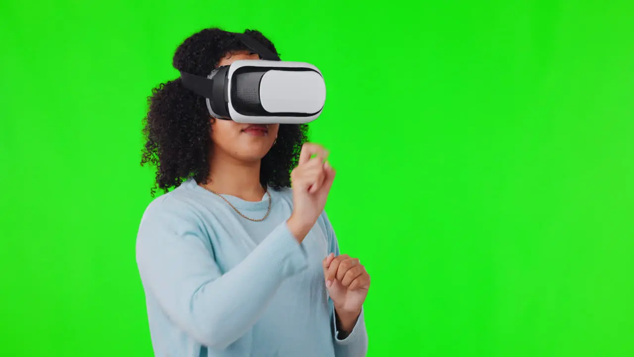 Woman on green screen with VR headset