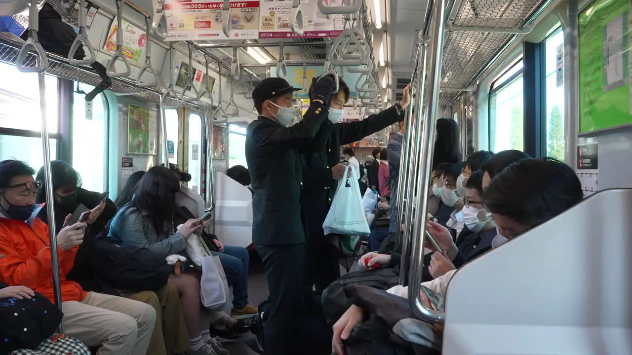 Straphanger Two Highschool Students Wearing Face Mask On Crowded Train Travelling In City Of Tokyo Japan