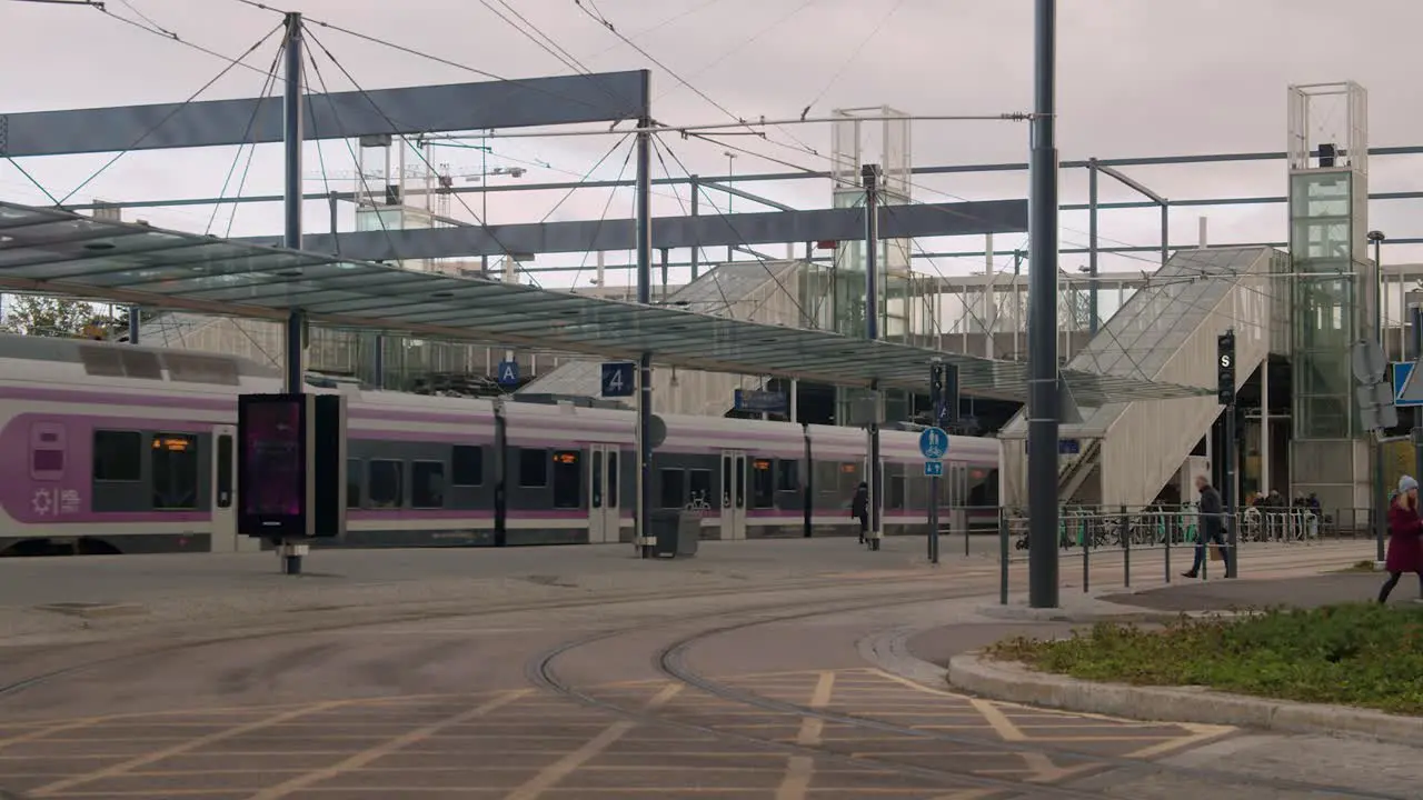 Modern commuter transit train departs station in Helsinki Finland