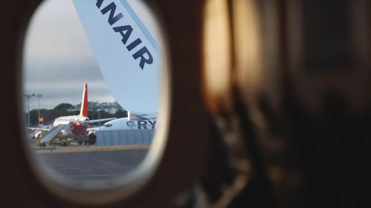 Wing With Logo From Window Of Airplane View During Plane Takeoff In Lisbon Portugal POV