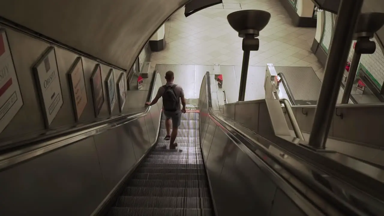 A point of view shot of a person using a London Underground Escalator