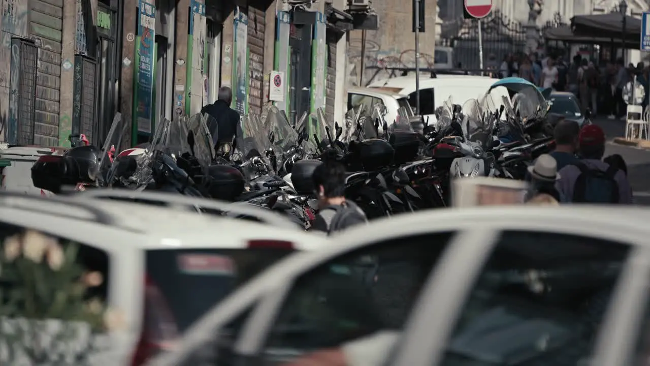 Busy Naples street with parked motorcycles