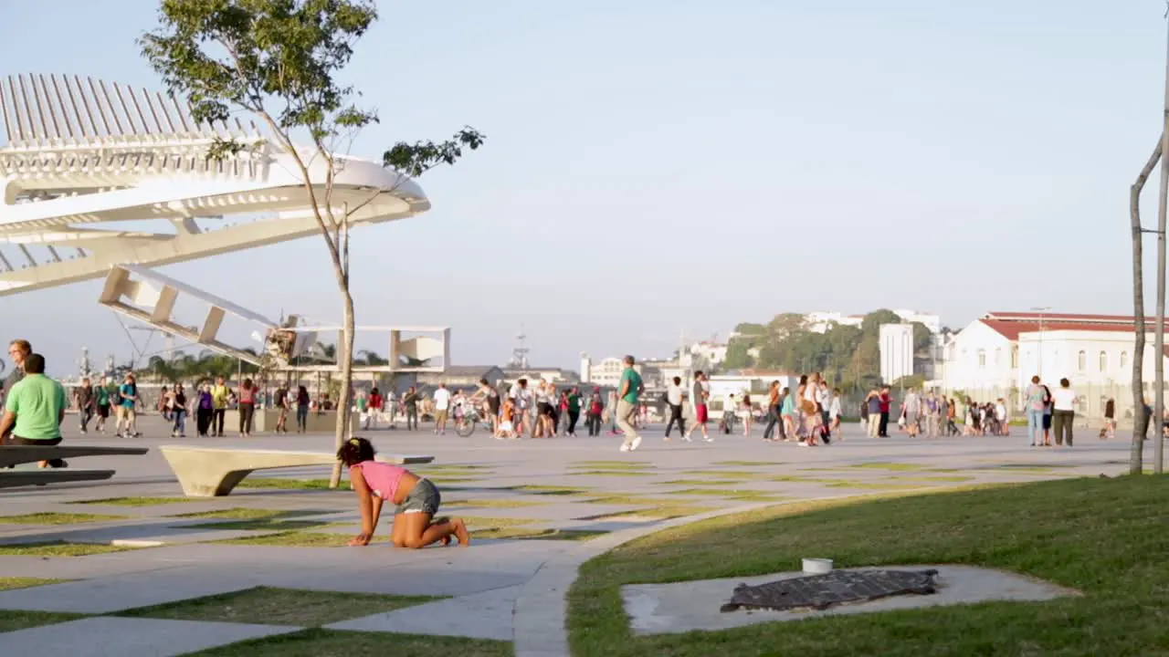 People relaxing at Praca Maua at sunset in the center of Rio de Janeiro Brazil on a Sunday afternoon