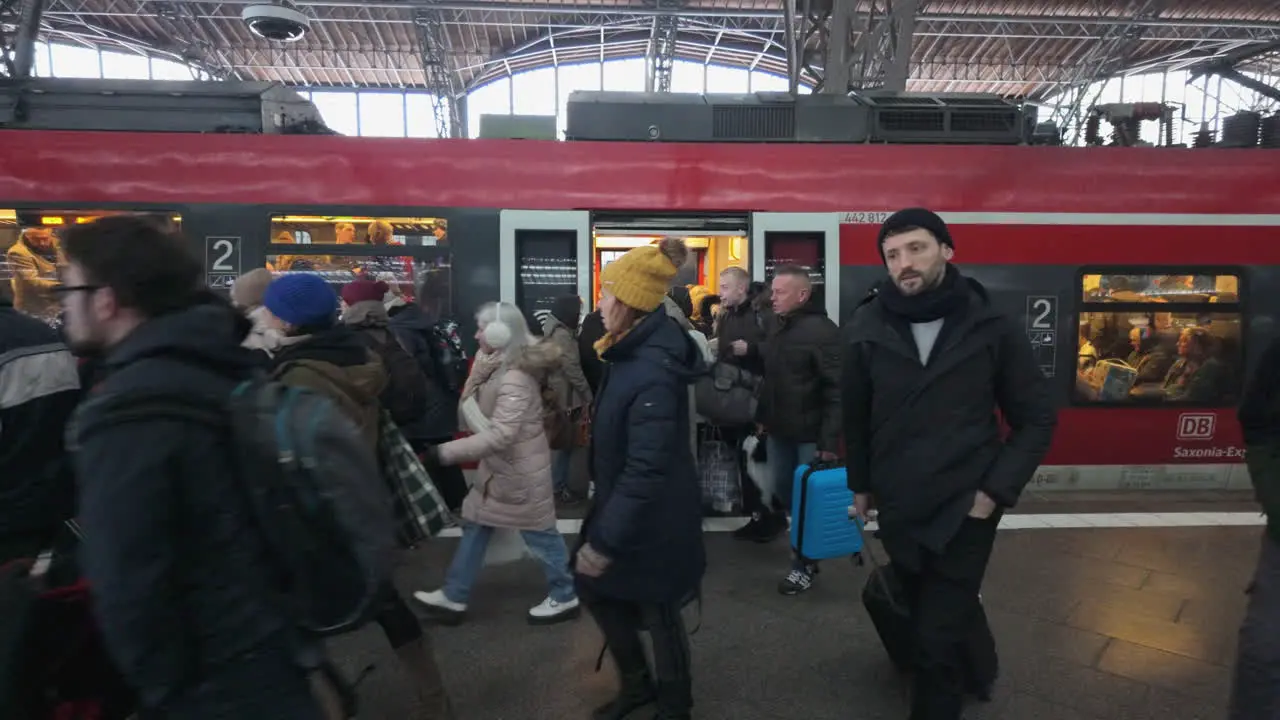 Large crowd of commuters rushing through Leipzig Central Station