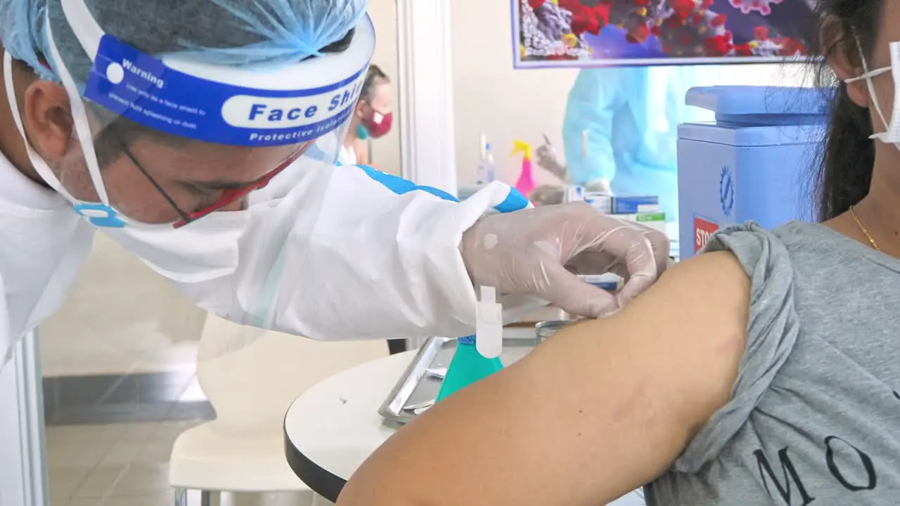 Woman With Face Mask Getting Vaccinated In A Public Hospital In Phnom Penh Cambodia Coronavirus Covid-19 and Vaccination Concept close up