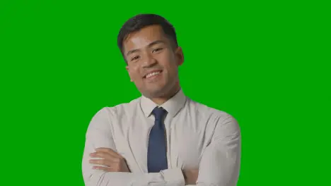 Portrait Of Businessman In Shirt And Tie Against Green Screen Smiling At Camera 2