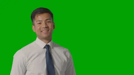 Portrait Of Businessman In Shirt And Tie Against Green Screen Smiling At Camera 3