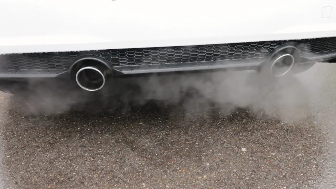 Car exhaustion close up with lots of smoke