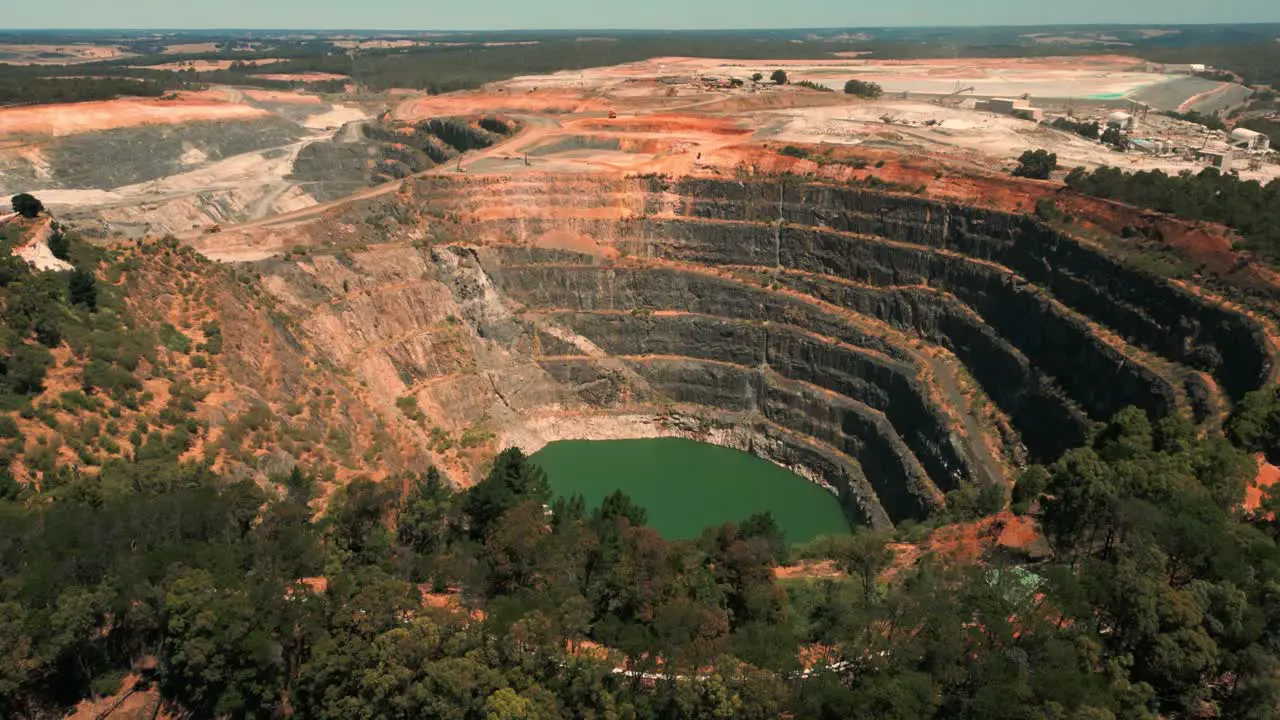 drone shot revealing flooded mine pit in Western Australia