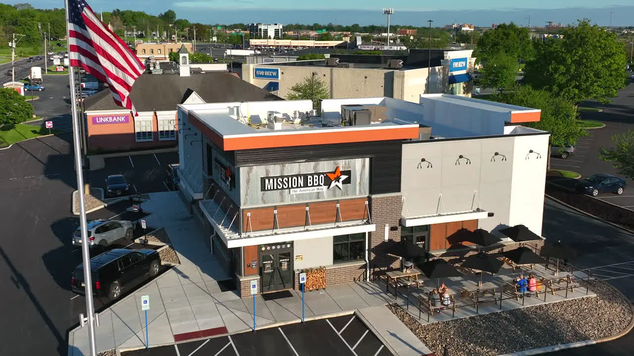 Aerial zoom out of Mission BBQ store