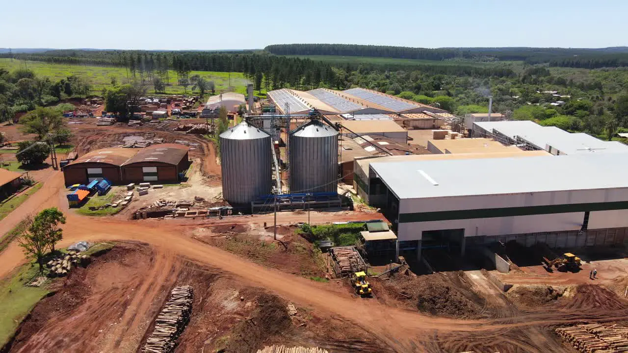 Drone advancing over a forest-industrial plant in argentina