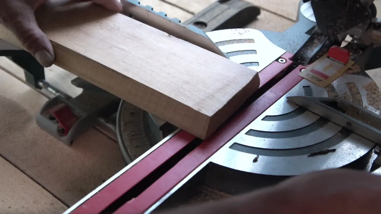 Setting up wood piece on electric saw