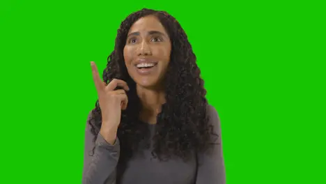 Portrait Of Woman Being Inspired By Good Idea Against Green Screen At Camera 2