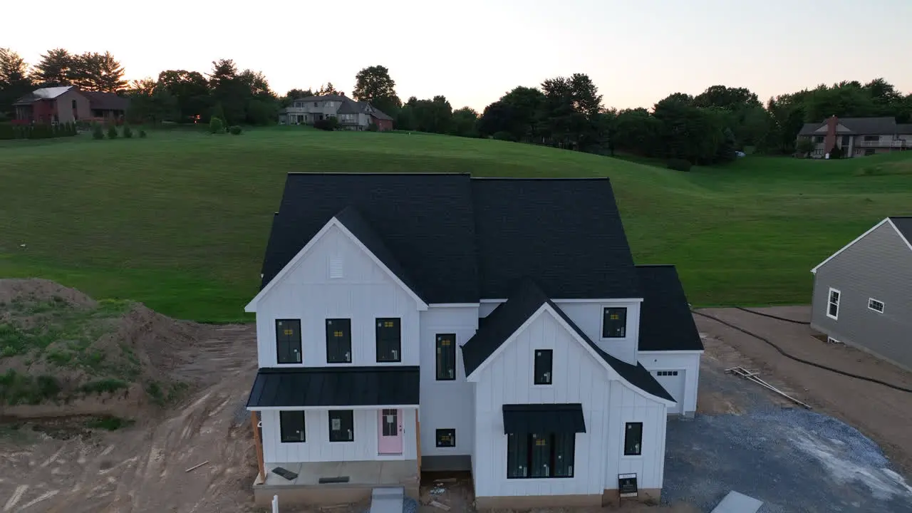 Rising aerial view of new home construction