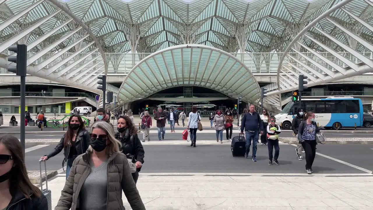 People walking at zebra crossing at Gare the Oriente main train station Lisbon