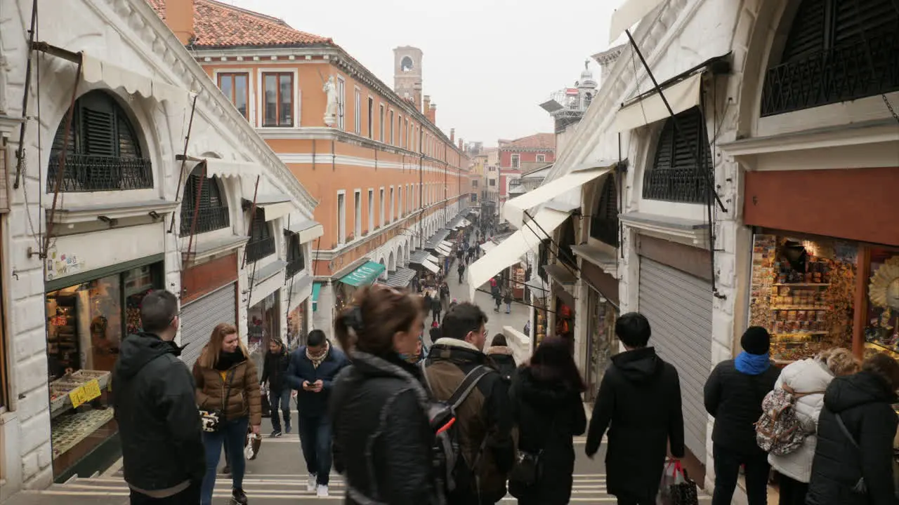 Looking down on the crowded street from Rialto Bridge after the cancelled Carnival