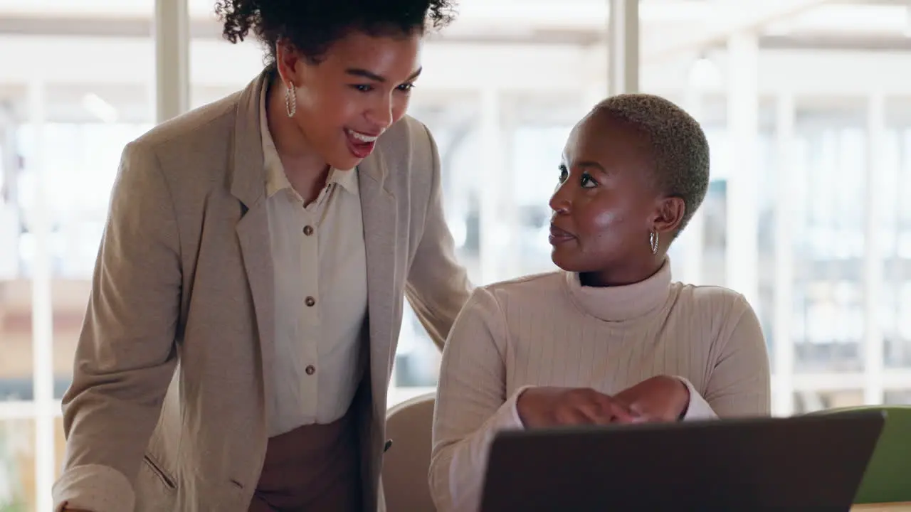 Corporate black women an laptop for typing