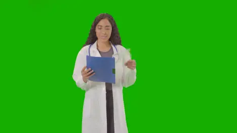 Portrait Of Female Doctor In White Lab Coat With Stethoscope Against Green Screen 2