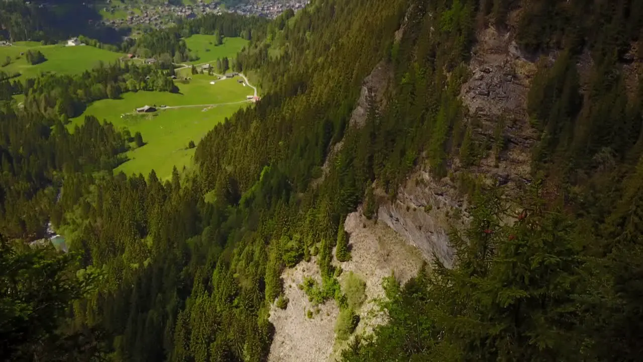 beautiful Swiss green valley then revelation of a vertical fall in the mountain