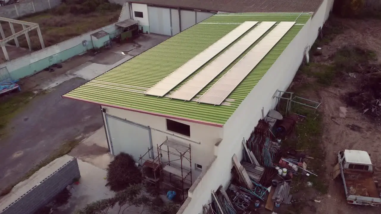 Green renewable warehouse with photovoltaic solar panel installed aerial