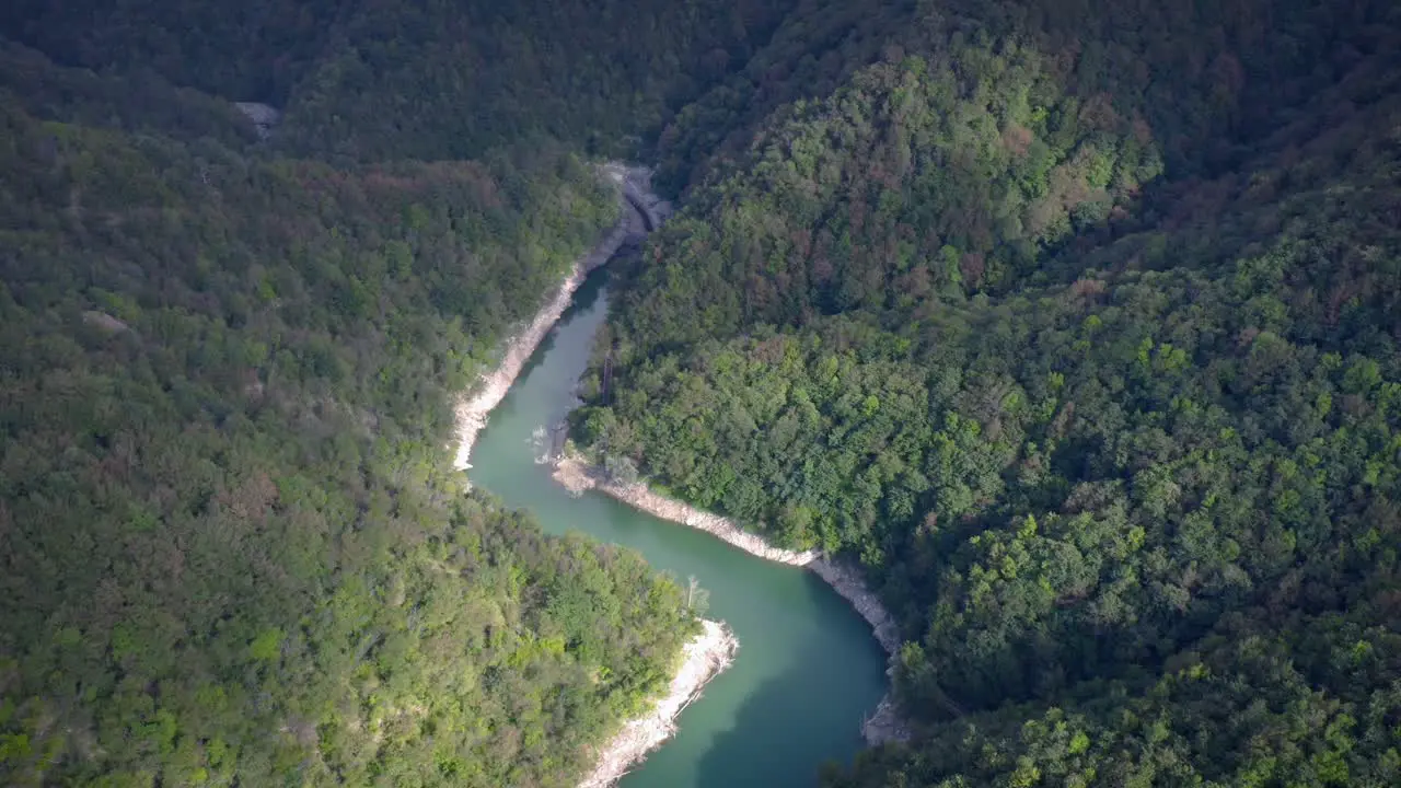 drone shot reveal an artificial lake near Genova Liguria Italy flying backwards