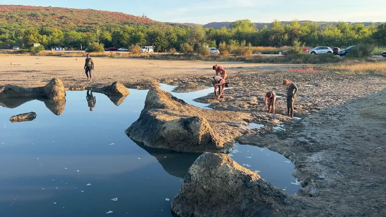 People applying mud in Cizici on Krk island Kvarner bay of Croatia