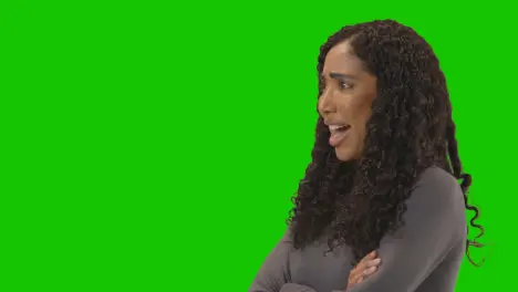 Profile Shot Of Angry Looking Woman Shouting At Camera Against Green Screen