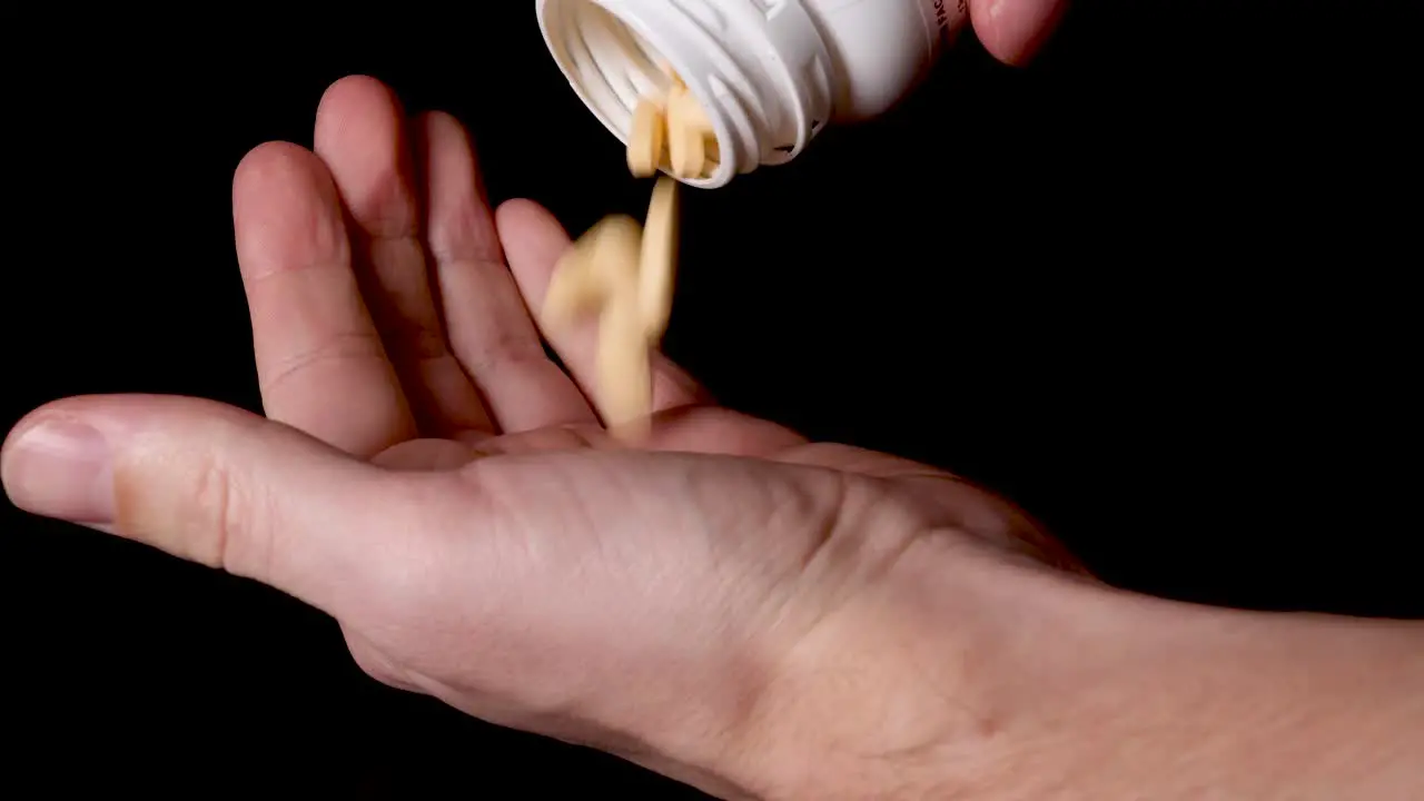 Prescription Drug Medication Pills Being Poured into Hand