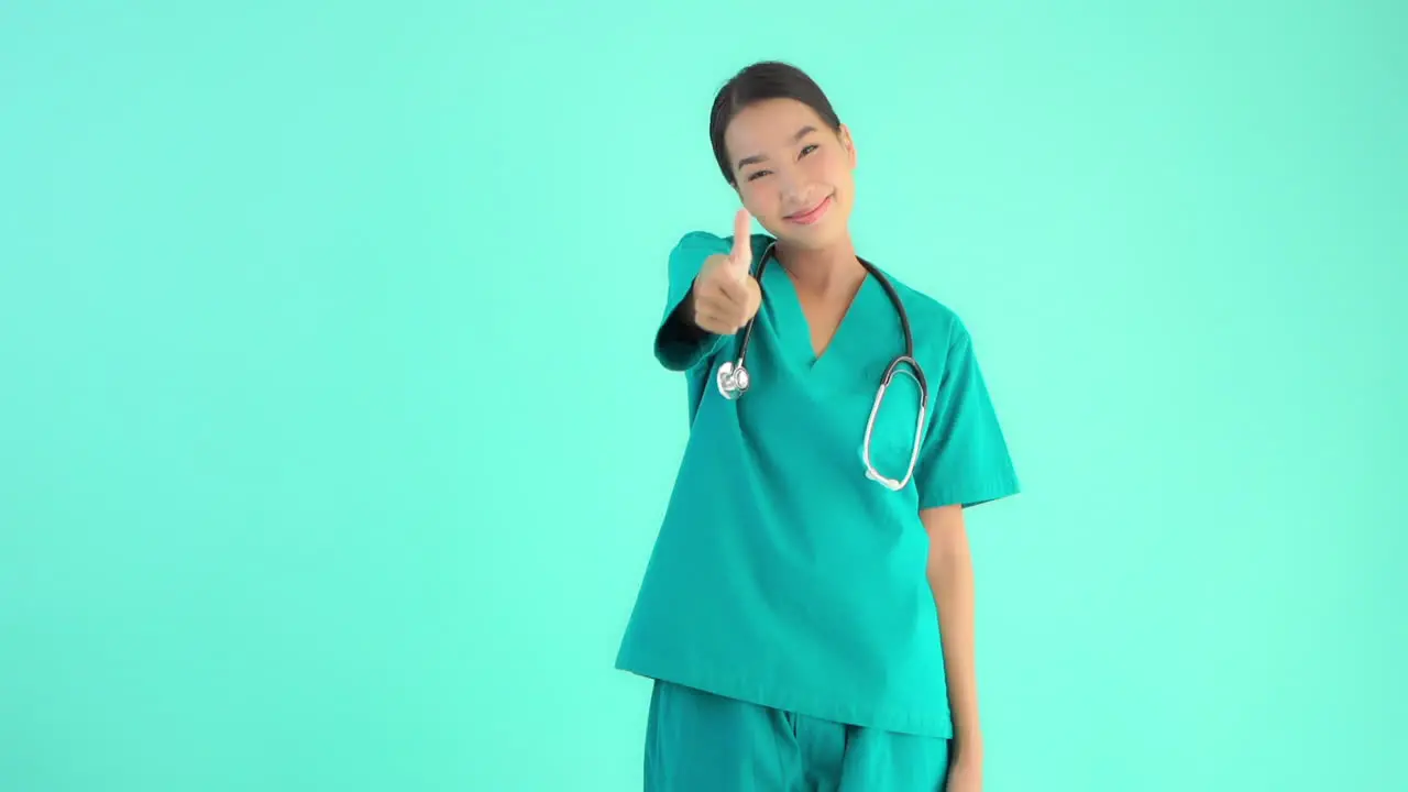 Nurse doctor giving thumbs up smiling happy